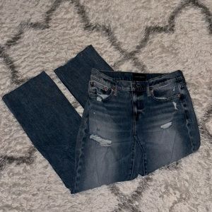 Lucky Brand medium/light wash jeans with small distress in size 2/26R